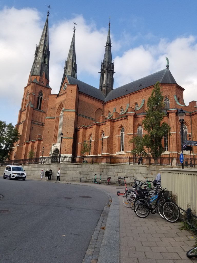 Photo of a large red brick church with tall pointy spires | Sweden and Denmark and Gustav I Vasa