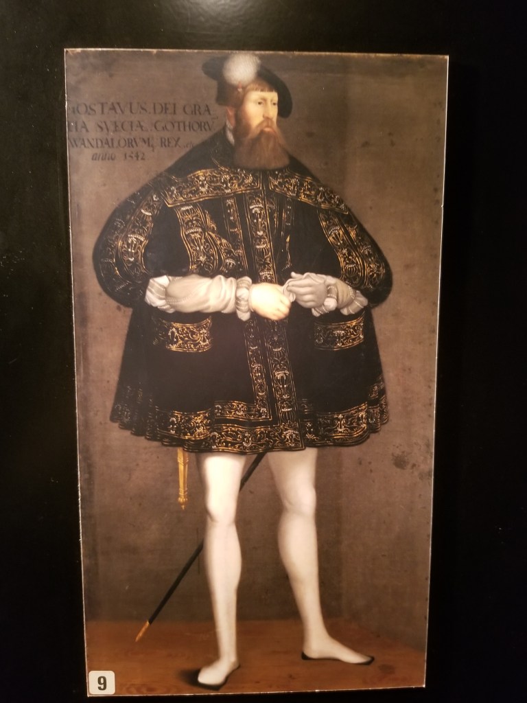 Painting showing The Swedish War King with an interesting hairdo and wearing a large robe.