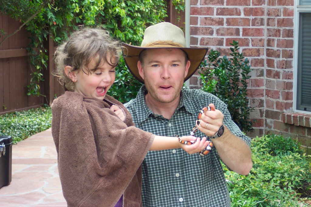 My daughter on the left is holding a milk snake. It has red, white/yellow and black bands | Red Touches Yellow Kill A Fellow