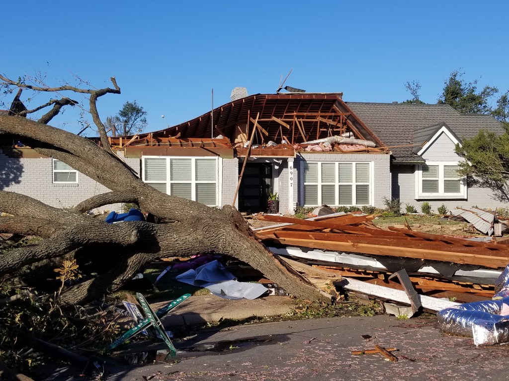 A neighbor’s house with the roof ripped off after the EF3 Tornado in Texas.