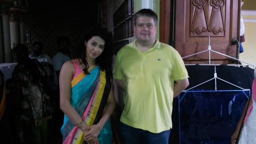 Young Indian woman on the left. Me in a yellow T-shirt on the right