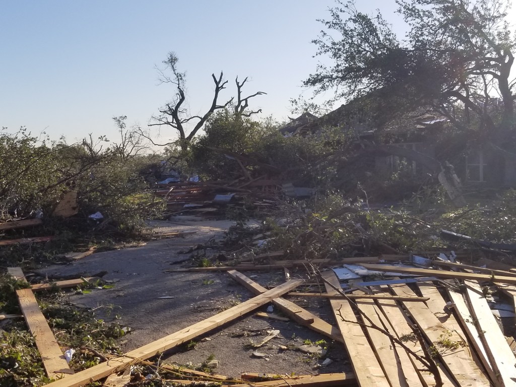 Debris on the street from a neighbor’s destroyed house.