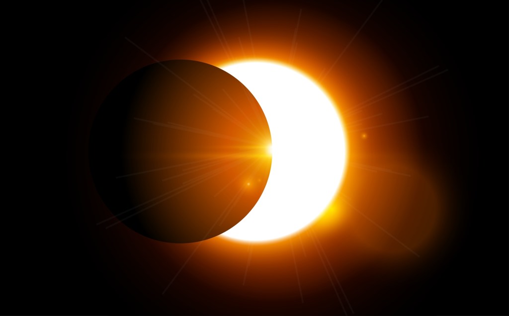 The moon is passing in front of the sun causing a partial solar eclipse.