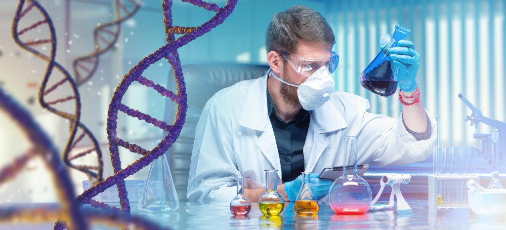 Man geneticist. Doctor sits at table in genetic laboratory. Chains of DNA or RNA. Sequencing human genome. Doctor studies DNA. Geneticist conducts scientific experiments Geneticist looks at test tubes