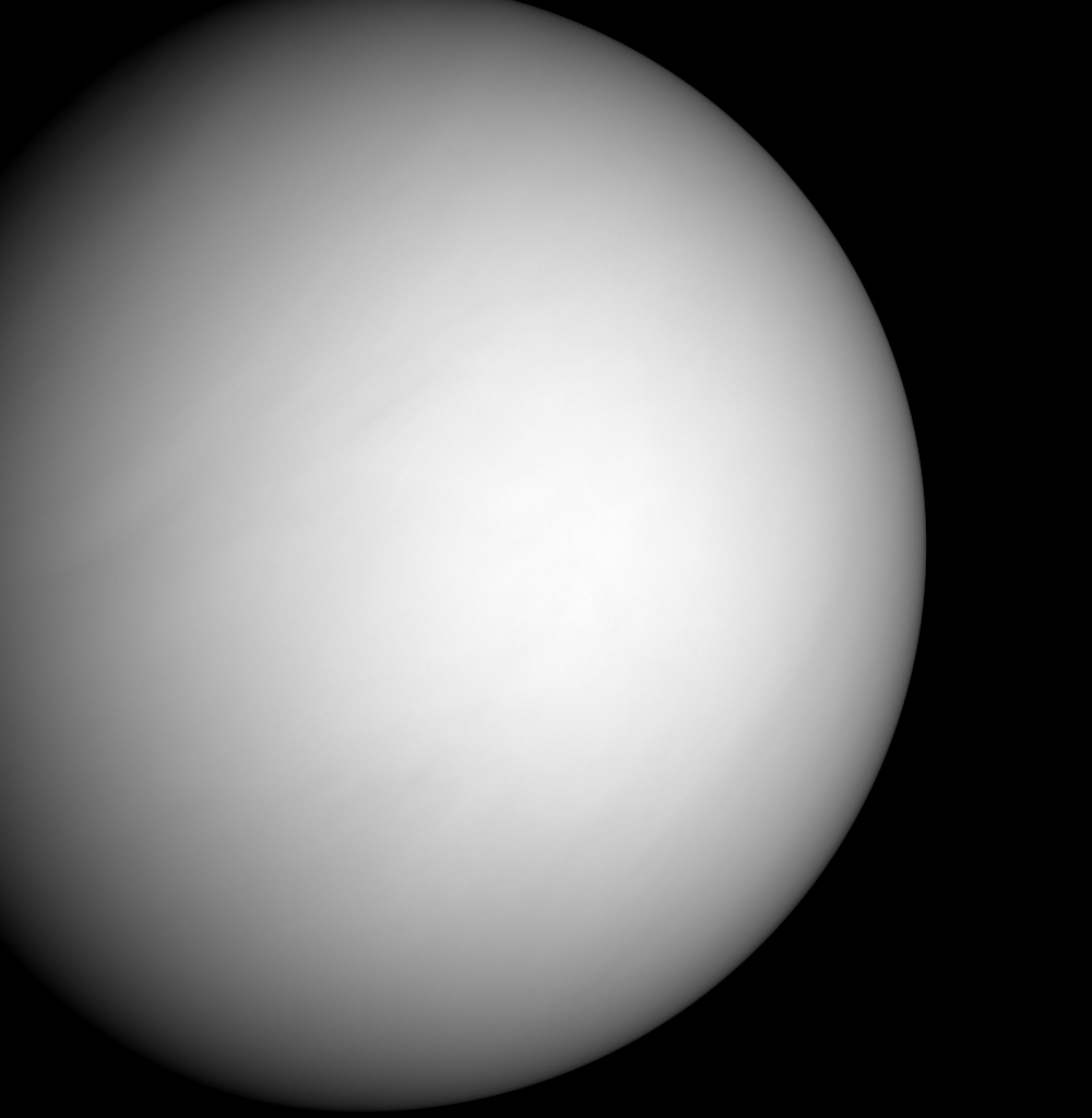 What we see in the photo is a large white smooth planet. The MESSENGER spacecraft snapped a series of images as it approached Venus on June 5, 2007. The planet is enshrouded by a global layer of clouds that obscures its surface to the MESSENGER Dual Imaging System (MDIS) cameras. This single frame is part of a color sequence taken that helped the MESSENGER team calibrate the camera in preparation for the spacecraft's first flyby of Mercury on January 14, 2008.