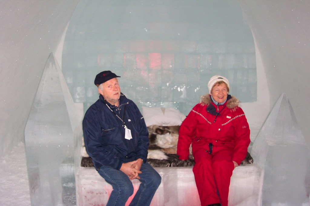 Stig left and Ulla right sitting on an ice bed in their room.