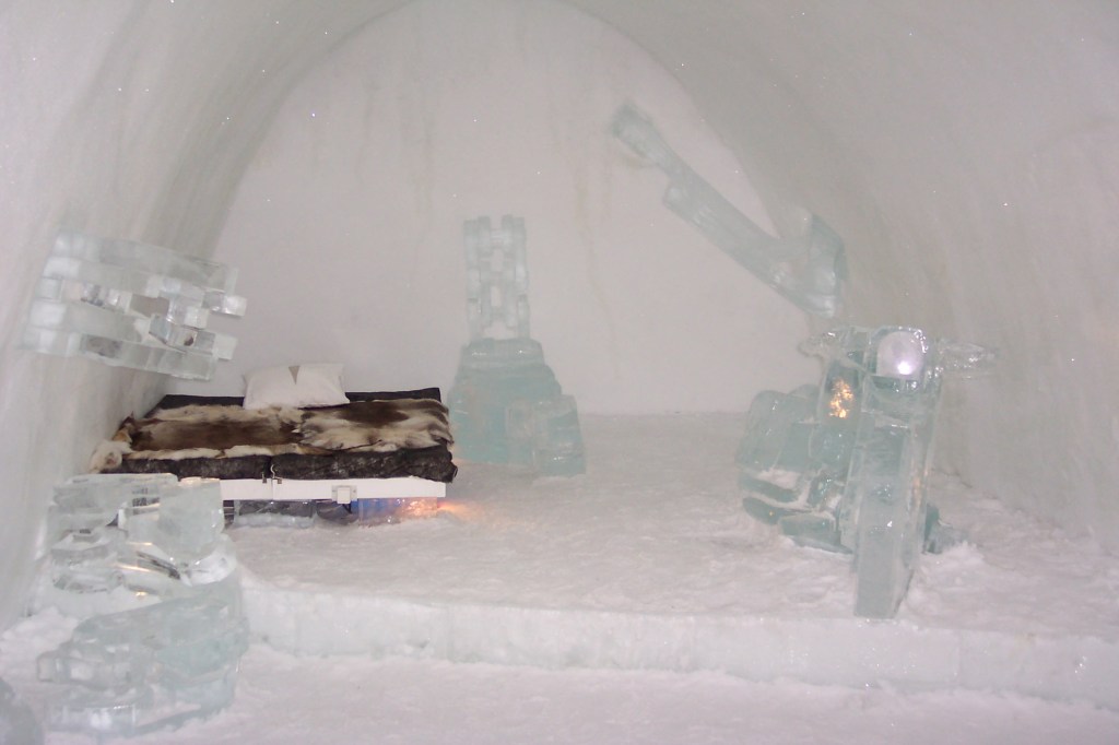 An ice room with an ice motorcycle and other ice art
