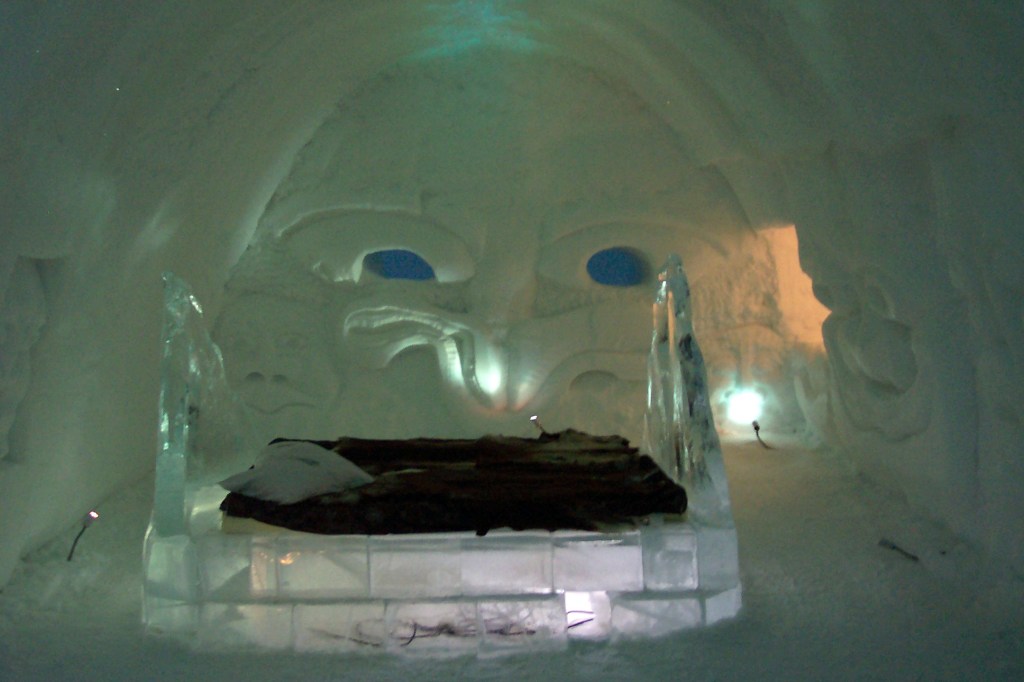 There is a huge ice and snow decoration on the wall featuring an angry looking face.