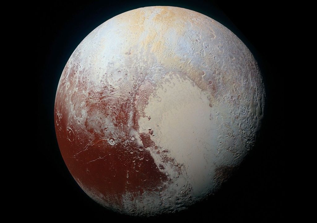 This picture features the photo of Pluto taken by NASA’s New Horizons spacecraft in 2015 plus some text.