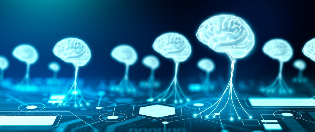 The picture shows multiple brains connected to a circuit board.