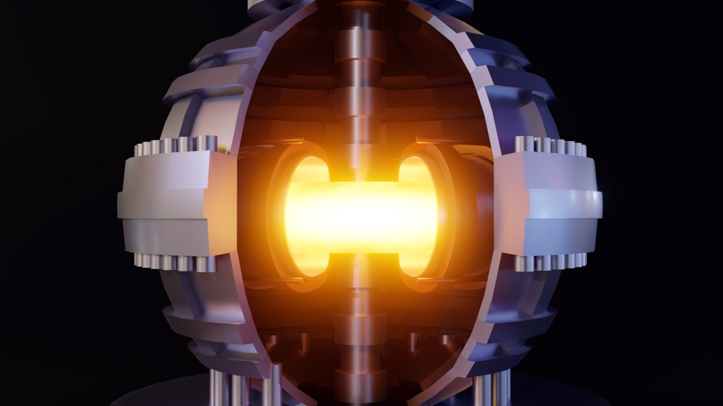 The pictures show a spherical metal shell, and inside the shell is a donut shaped metal shell, and inside that shell there is glowing super-heated plasma.